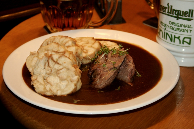 Demínka, with its chunks of wild boar in  rosehip sauce and Karlovy Vary-style dumplings