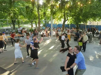 We dance outdoors during the summer.