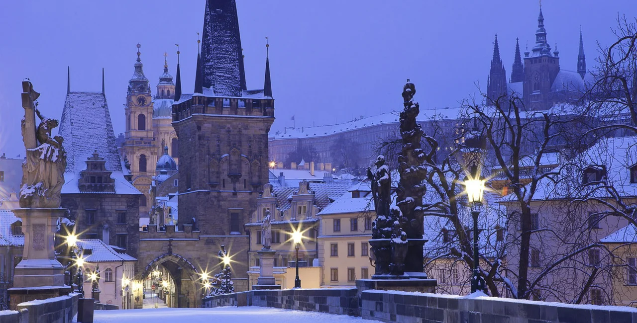 Prague Charles Bridge, covered in a fresh layer of snow