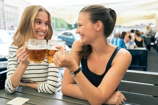Female colleagues sharing an after-work beer in Prague