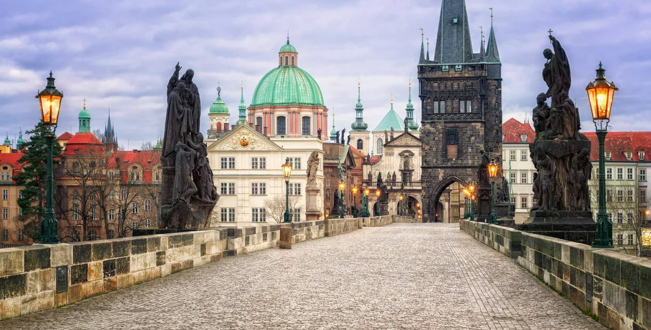 Charles bridge and the skyline of Prague, Czech Republic, in the early morning light