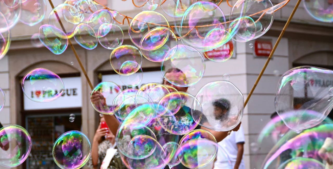 Prague,  Czech Republic -August 28, 2018 : A street artist  makes large soap bubbles in the historical center