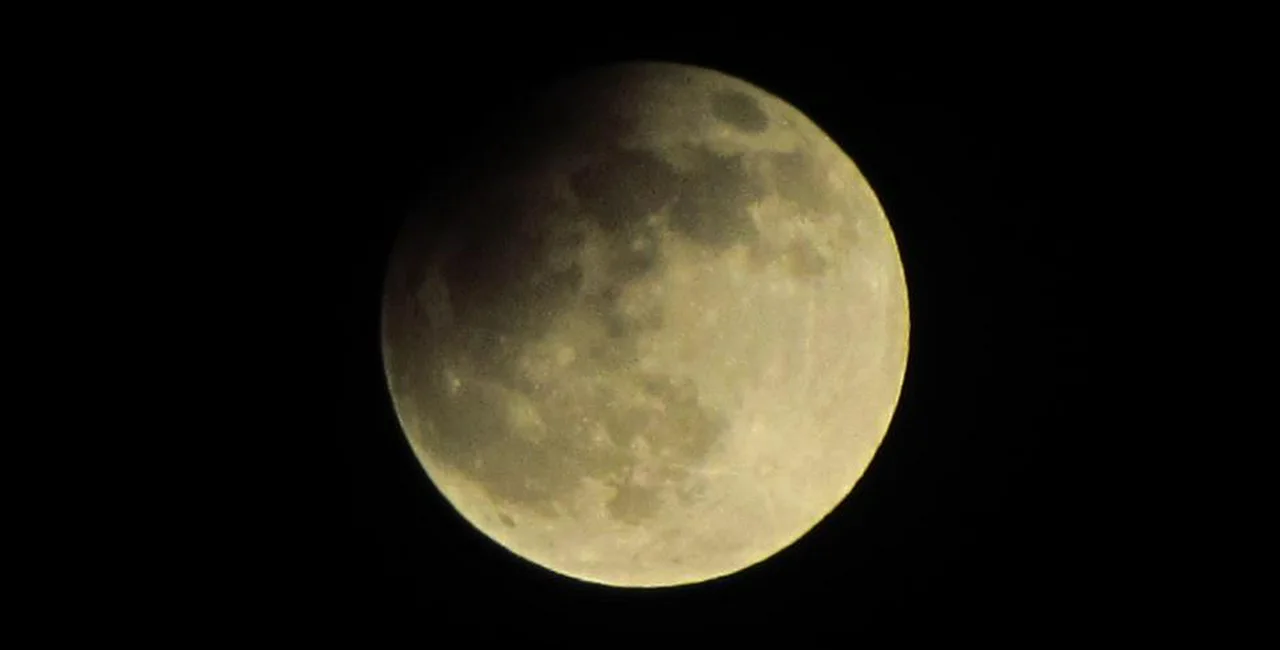 Partial lunar eclipse over Prague. via Raymond Johnston