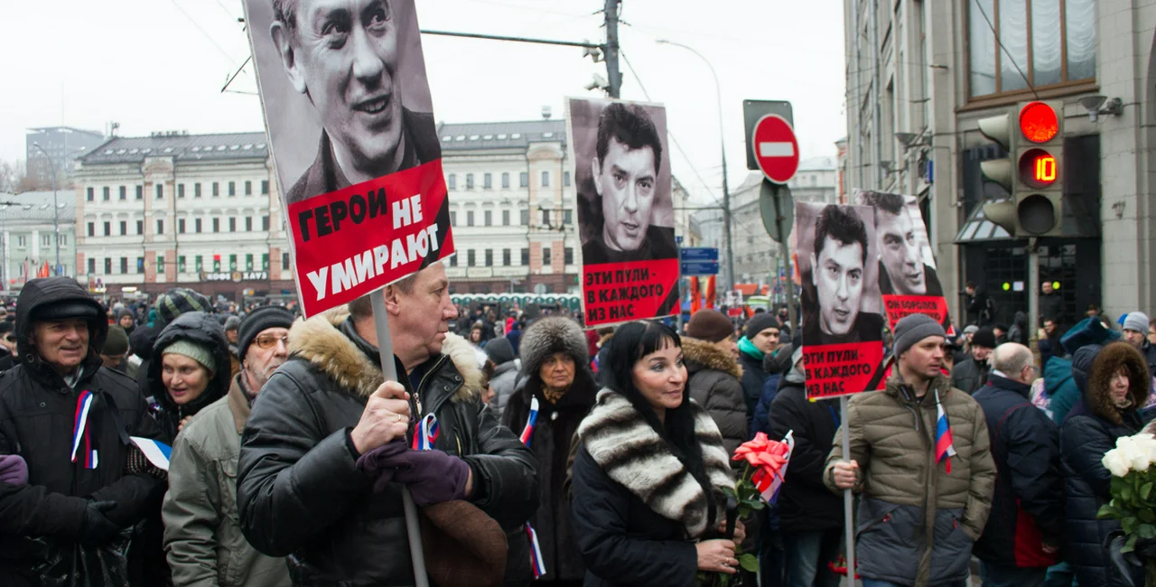 Moscow, Russia - March 1, 2015. Nemtsov's portraits on mourning march of memory via iStock.com / olegkozyrev