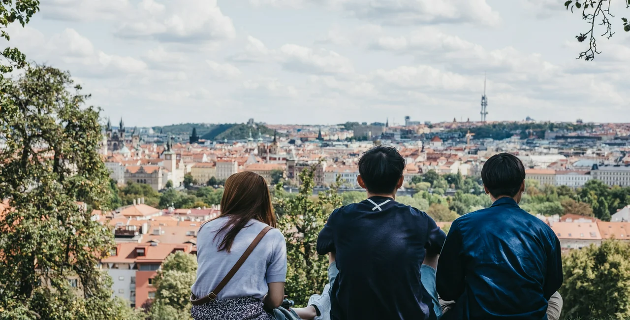 A group of people overlooking Prague, Czech Republic