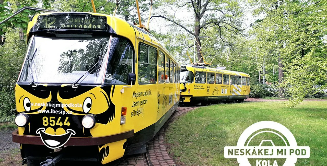 Yellow tram with safety warnings. via Neskákej mi pod kola / Facebook
