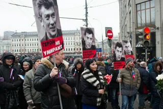 Moscow, Russia - March 1, 2015. Nemtsov's portraits on mourning march of memory via iStock.com / olegkozyrev