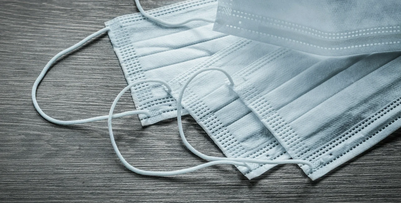 White protective sterile face masks via iStock / mihalec