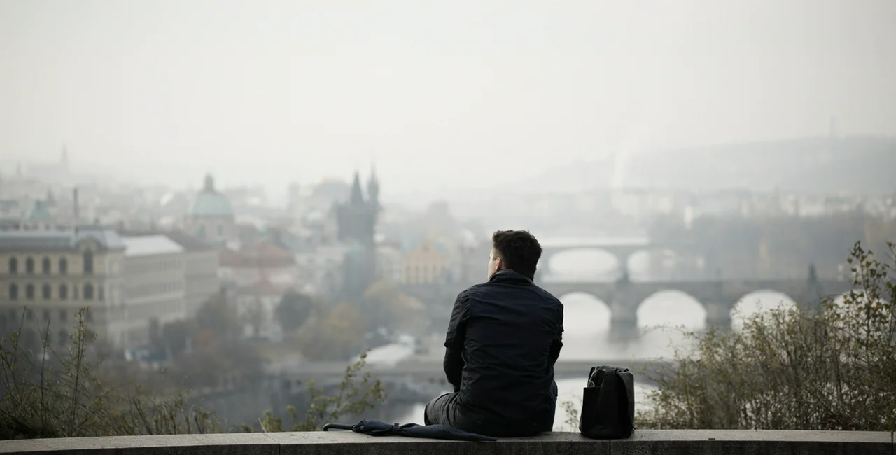 Man overlooking Prague via iStock / Chalabala
