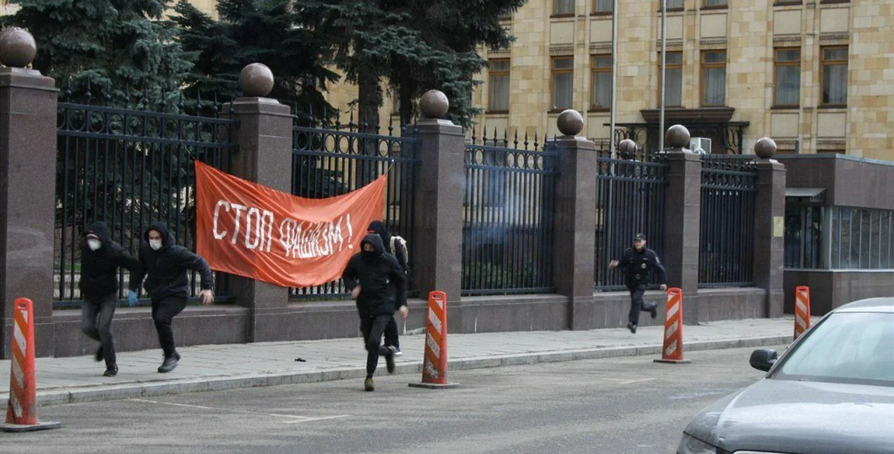 Russian extremists run from police outside the Czech embassy in Moscow. Photo via The Other Russia