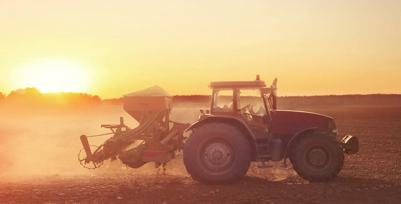 Tractor working on dry field via iStock / narvikk