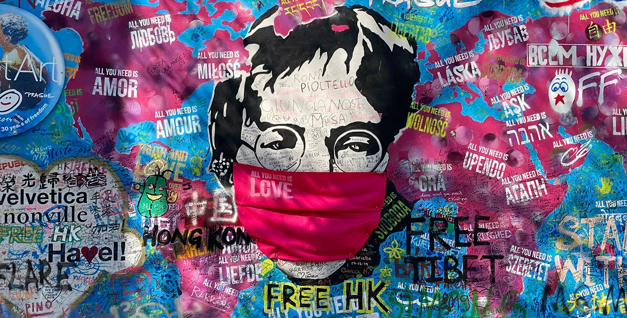 Even Prague's Lennon Wall has donned a face mask. Photo via Lucas Nemec