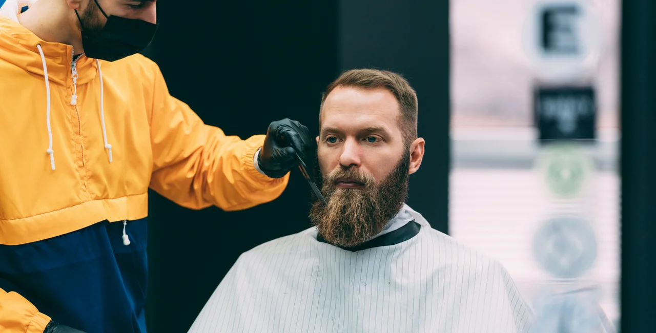 Barber with face mask and gloves via iStock / martin-dm