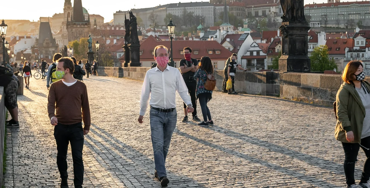 People wearing face masks on Prague's Charles Bridge via iStock / Madeleine_Steinbach