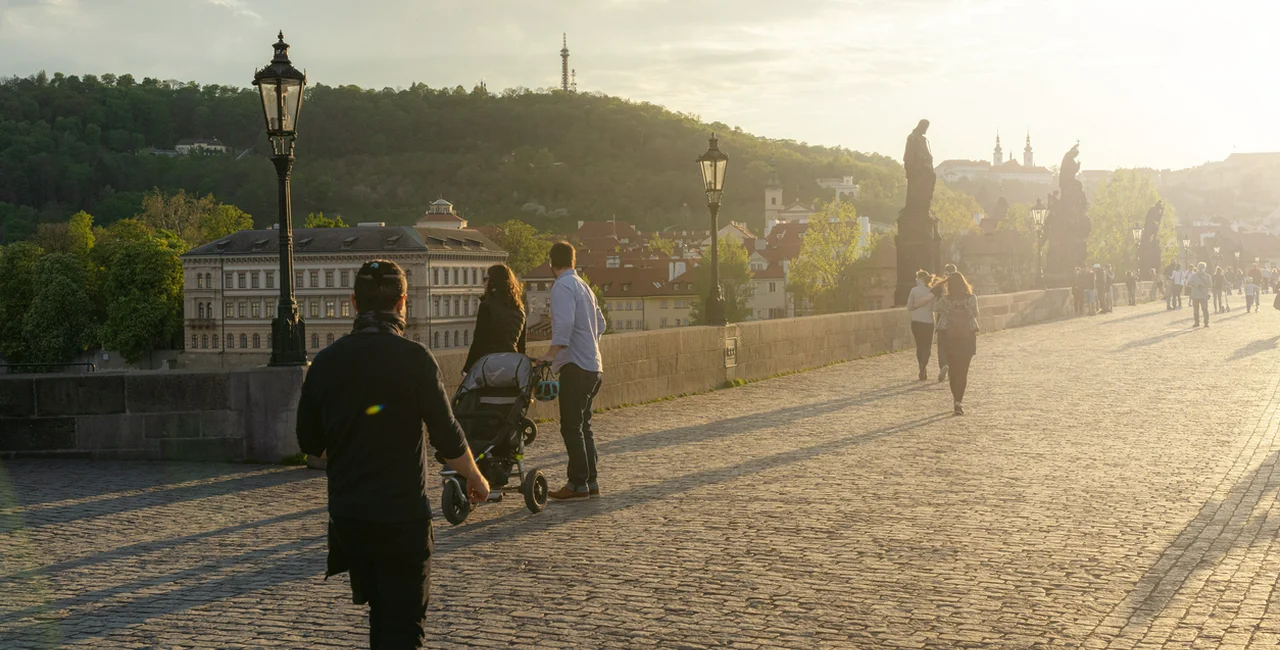 People wearing face masks on Prague's Charles Bridge via iStock / hopsalka