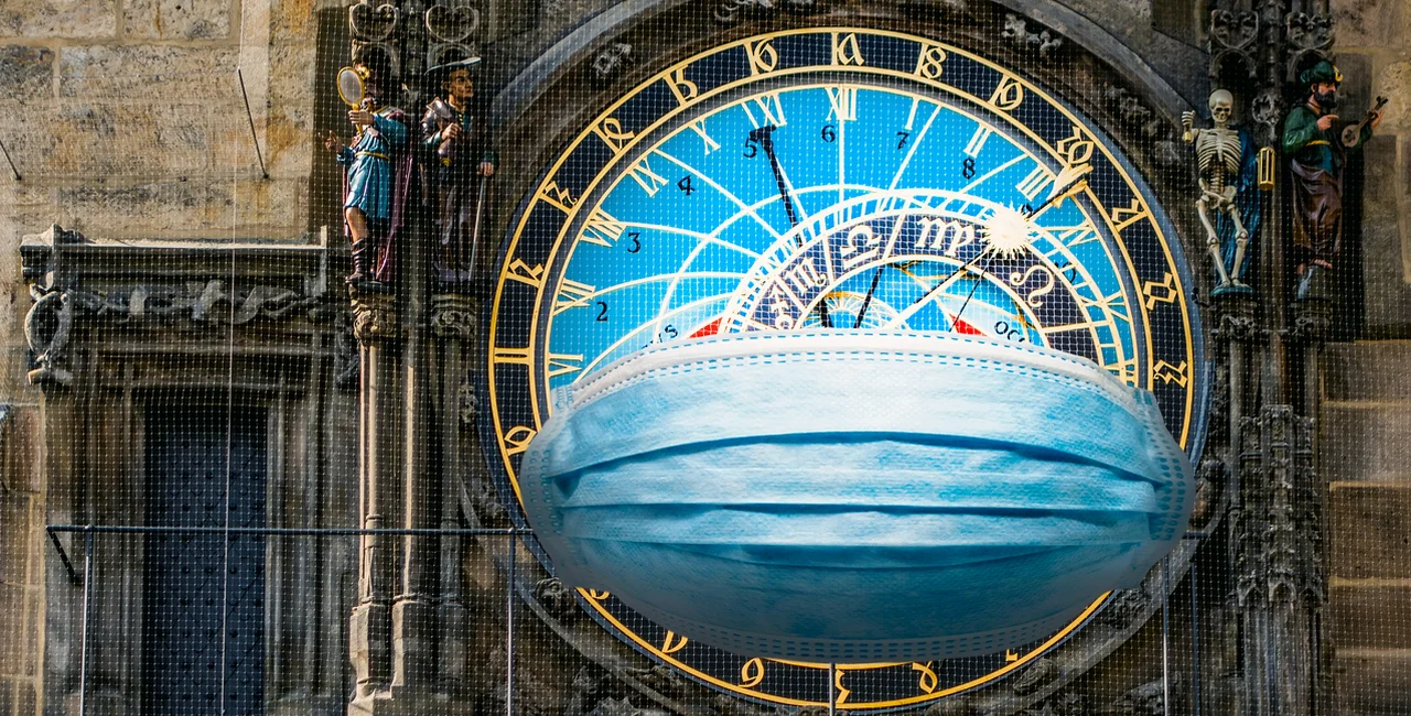 Face mask over Prague's Astronomical Clock via iStock / Vladyslav Danilin