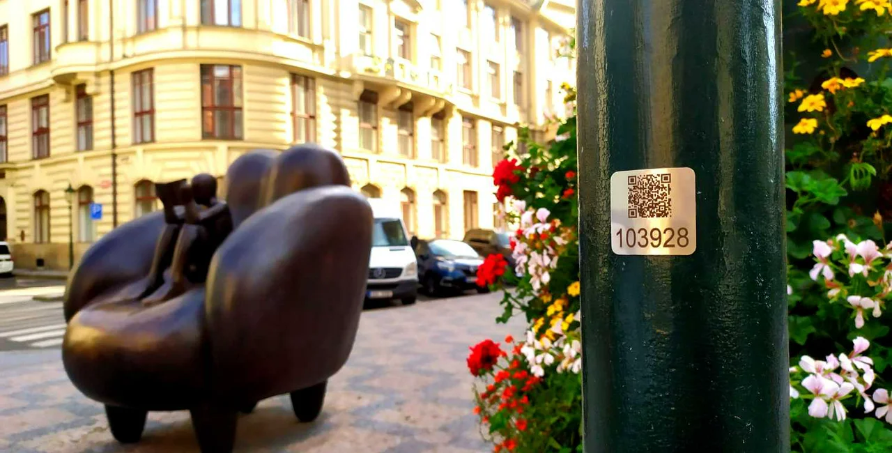 QR code on a lamp post near Old Town Square / via Raymond Johnston