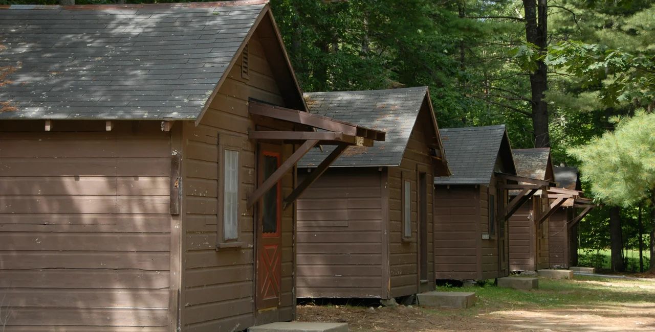 Camp camp cabins via iStock / roballen38