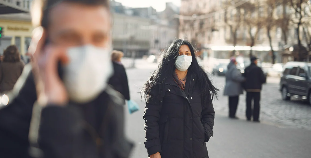 A woman wearing a face mask. 