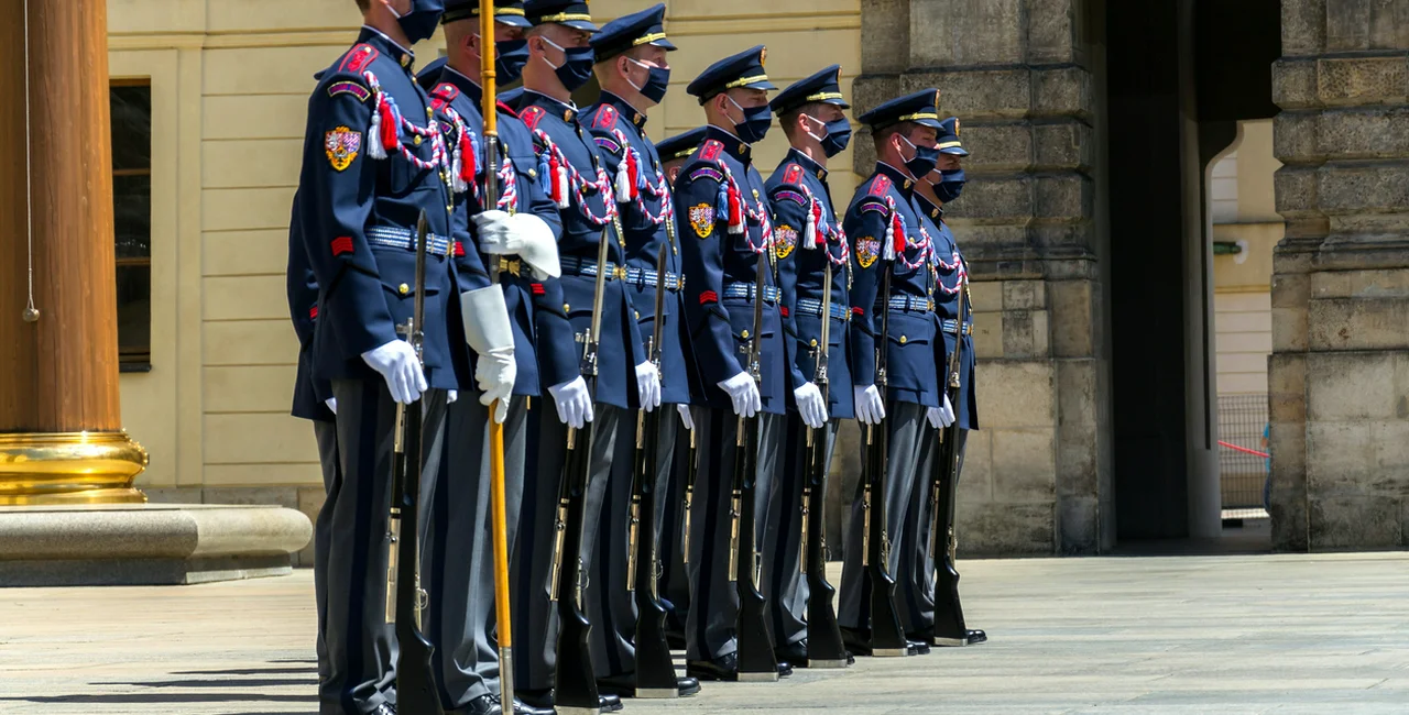 Soldiers wearing face masks during the changing of the guard at Prague Castle via iStock / josefkubes