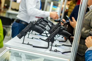 Firearms on display in a gun store via iStock / artas