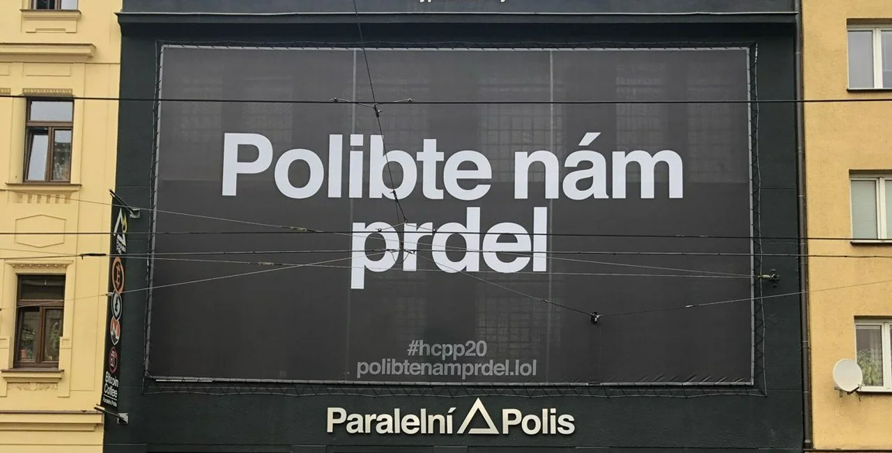 "Kiss our ass" Banner hung above Paralelní Polis via Paralelní Polis