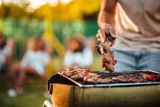 Meat on the grill via iStock / nortonrsx