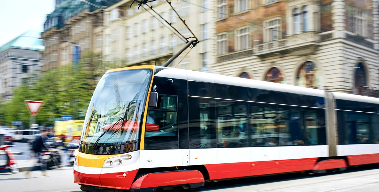 Daily life in the city. Modern tram of public transportation in blurred motion. Traffic at Wenceslas Square, Prague, Czech Republi