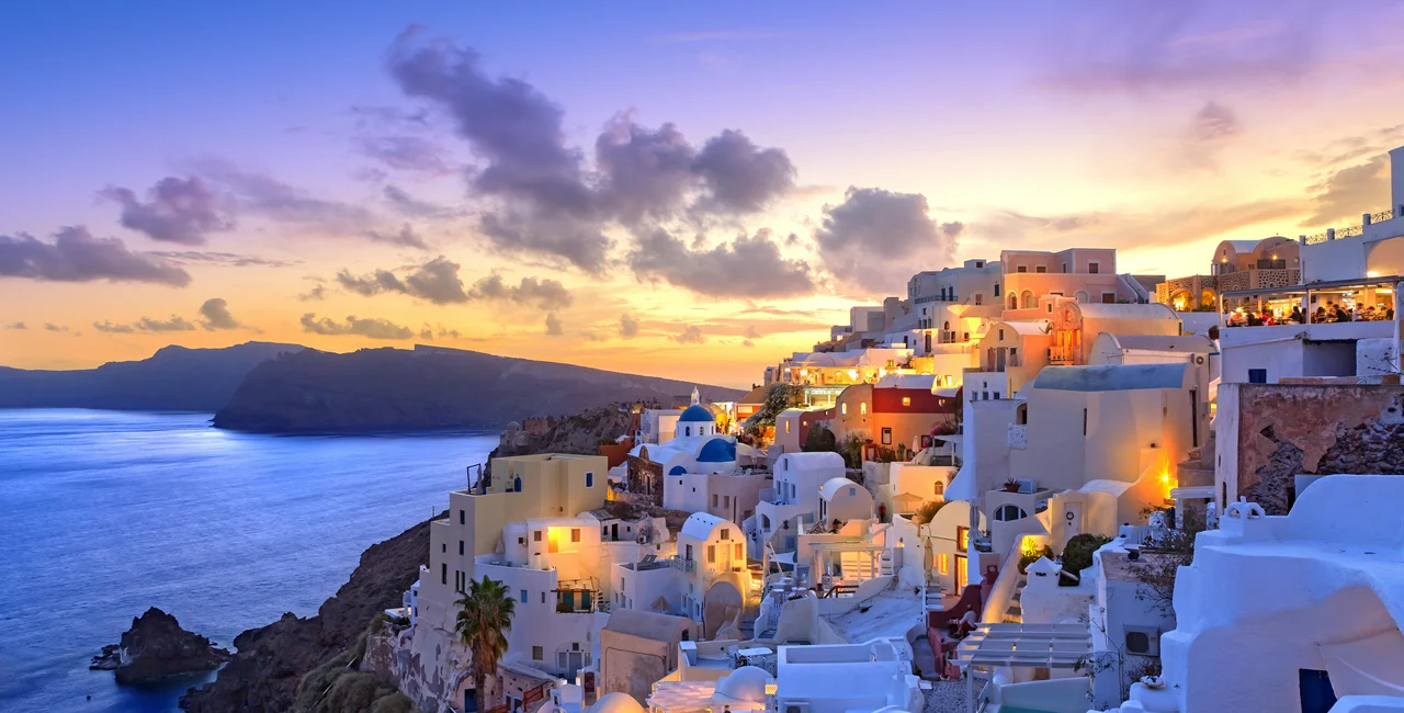 Santorini sunset at dawn village of Oia Greece. Photo: iStock/Grafissimo