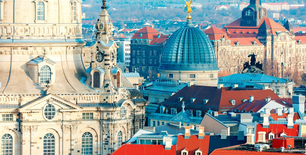 Aerial view over Frauenkirche and glass dome of Academy of Fine Arts or Lemon Squeezer and roofs of old Dresden, Saxony, Germany