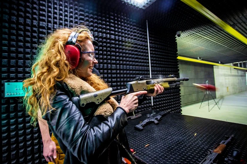 Czech actor Denisa Nesvačilová with pump action shotgun at Prague Armory shooting range during