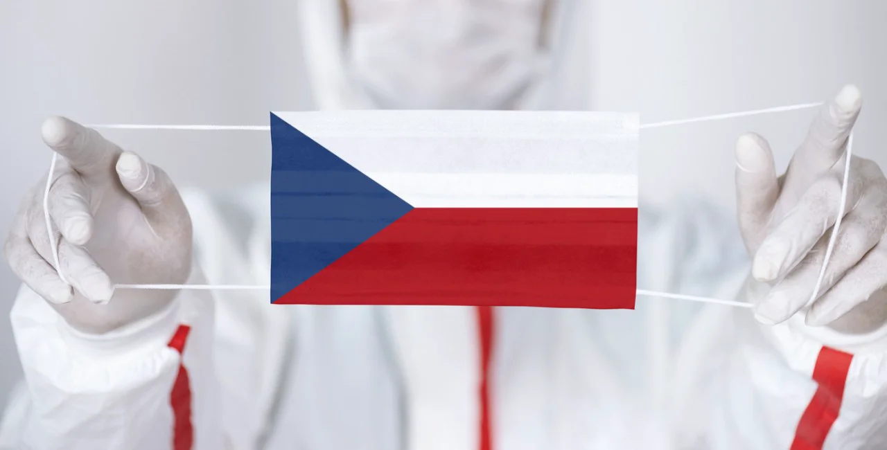 Health professional with face mask in style of Czech flag. Illustrative concept via iStock / kemalbas