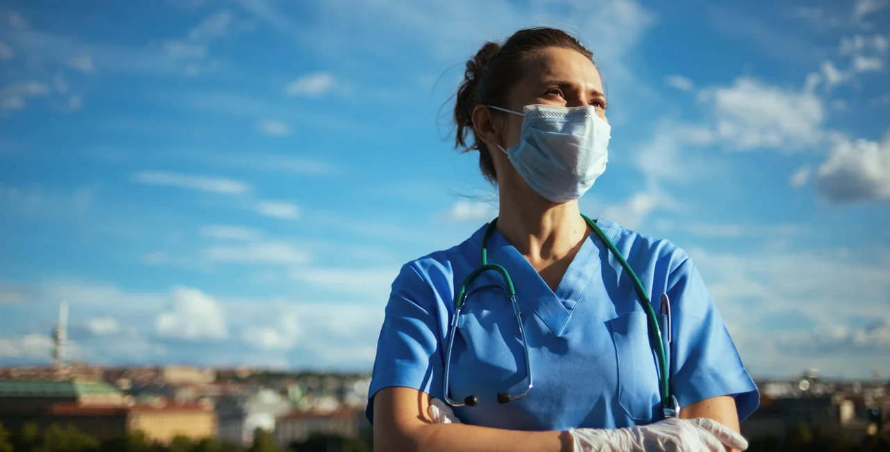Medical professional with face mask in Prague via iStock / CentralITAlliance