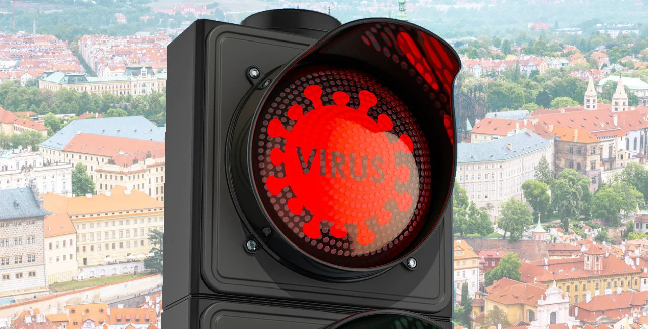 Traffic light Virus with red light against blue sky, 3d rendering via iStock / AlexLMX
