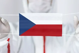 Health professional with face mask in style of Czech flag. Illustrative concept via iStock / kemalbas