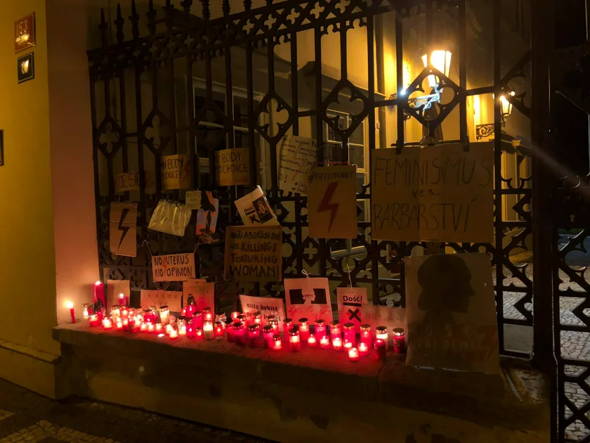 Candles in signs outside the Polish Embassy in Prague