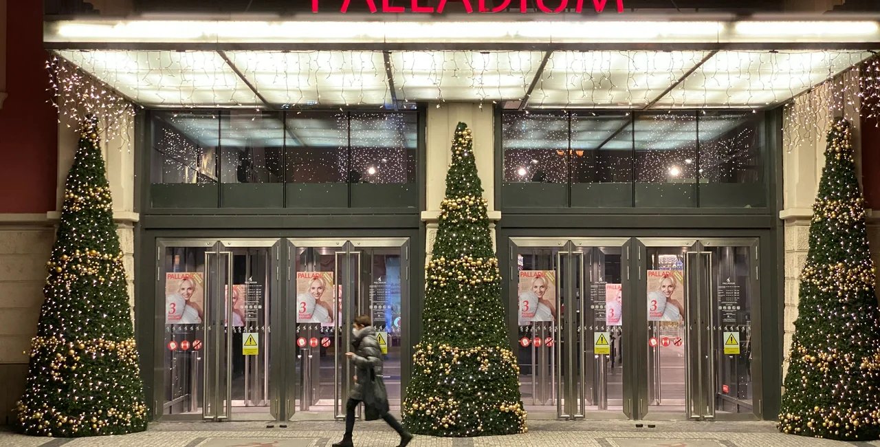 A passerby in front of Palladium shopping mall in Prague. (photo:  Jason Pirodsky - Expats.com)