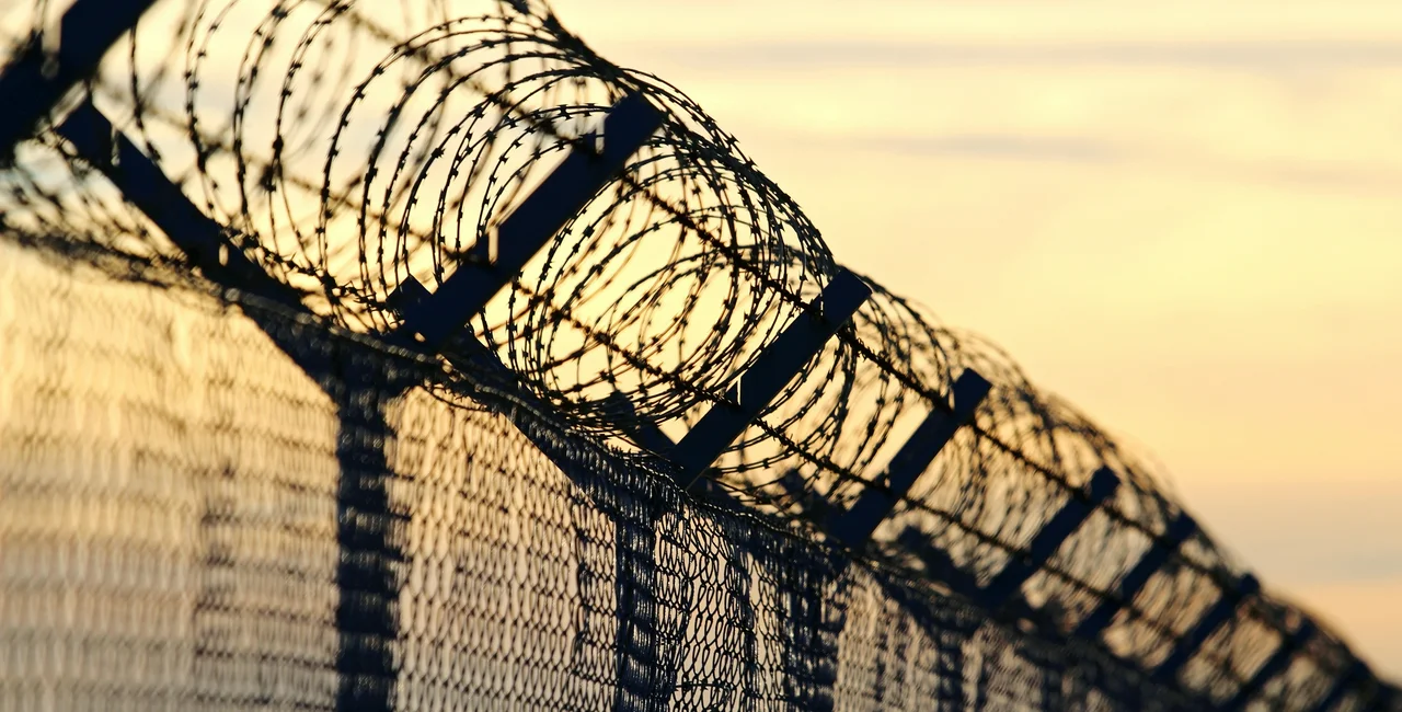 Barbed wire on a fence. (photo: iStock / kodda)