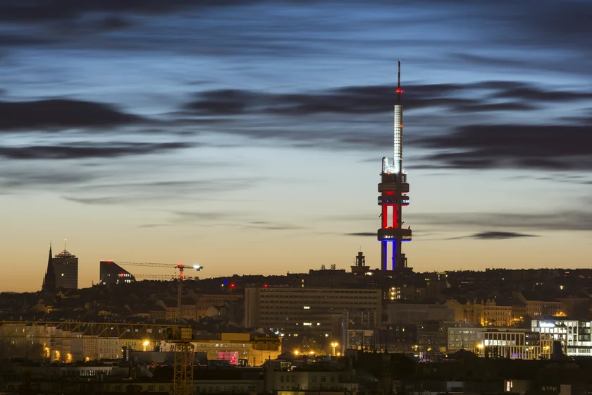 Prague skyline with the Žižkov TV Tower lit up in the colors of the Czech flag via iStock / arsenisspyros
