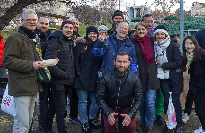 Volunteers and clients pose for a group photo at a 'Help Prague’s Homeless' Christmas event last year. (photo: Help Prague’s Homeless)