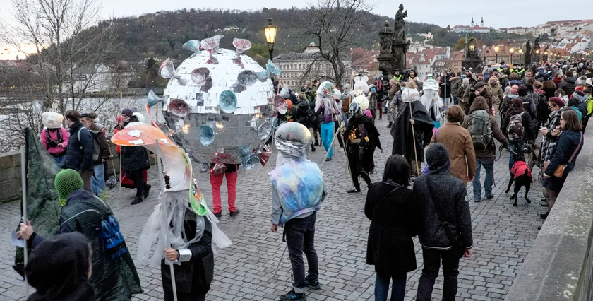 The 'Velvet Carnival' participants embody pressing social and political issues by using oversized masks, allegorical constructions and satirical pamphlets to convey their message. (photo: James Fassinger - Expats.cz)