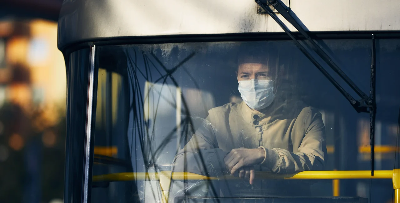 A man wearing a face mask on a Prague tram via iStock / Chalabala