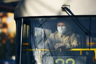 A man wearing a face mask on a Prague tram via iStock / Chalabala