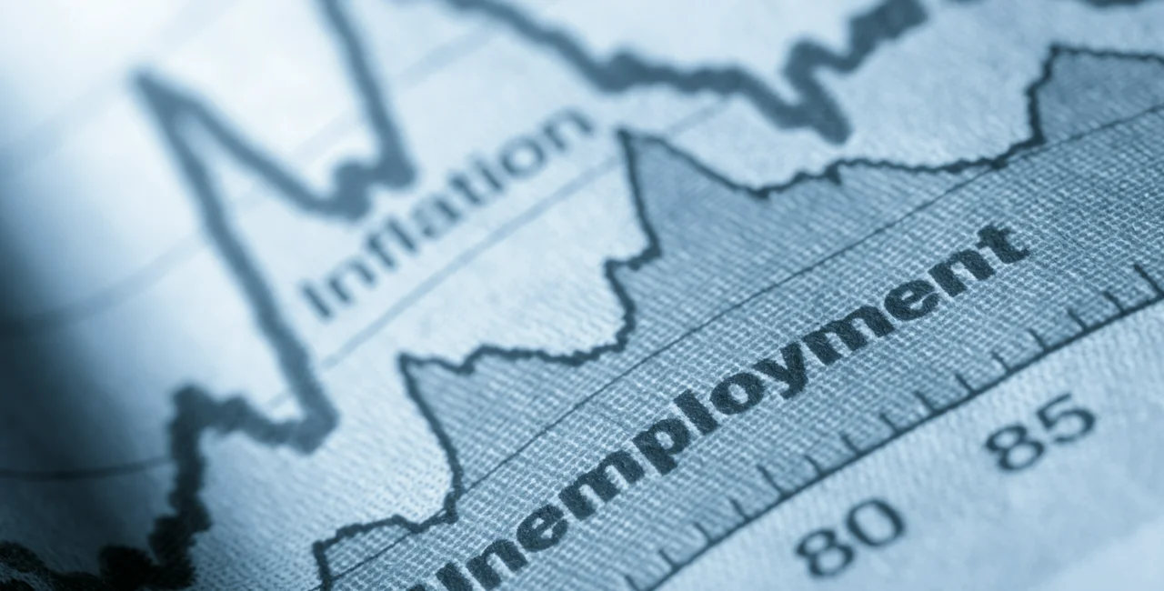 Business graph unemployment and inflation in newspapers (Image via iStock photo @JLGutierrez)