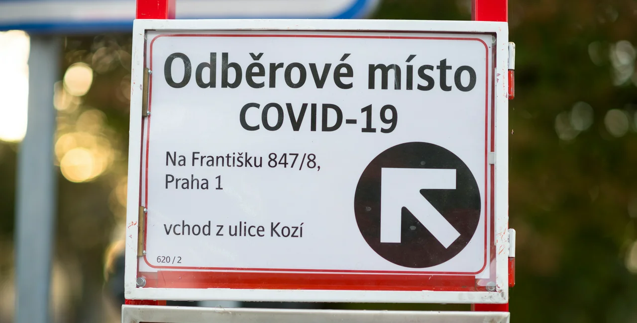 Czech Bus stop with sign pointing to testing area