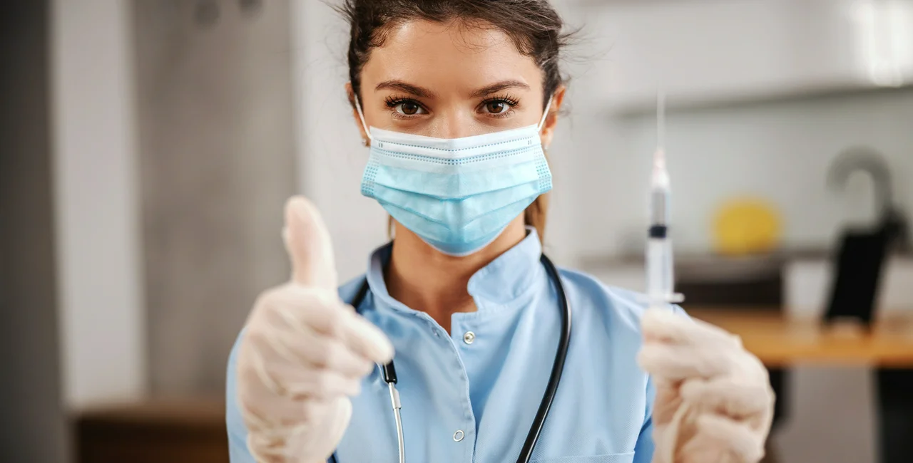 Nurse with syringe via iStock / dusanpetkovic