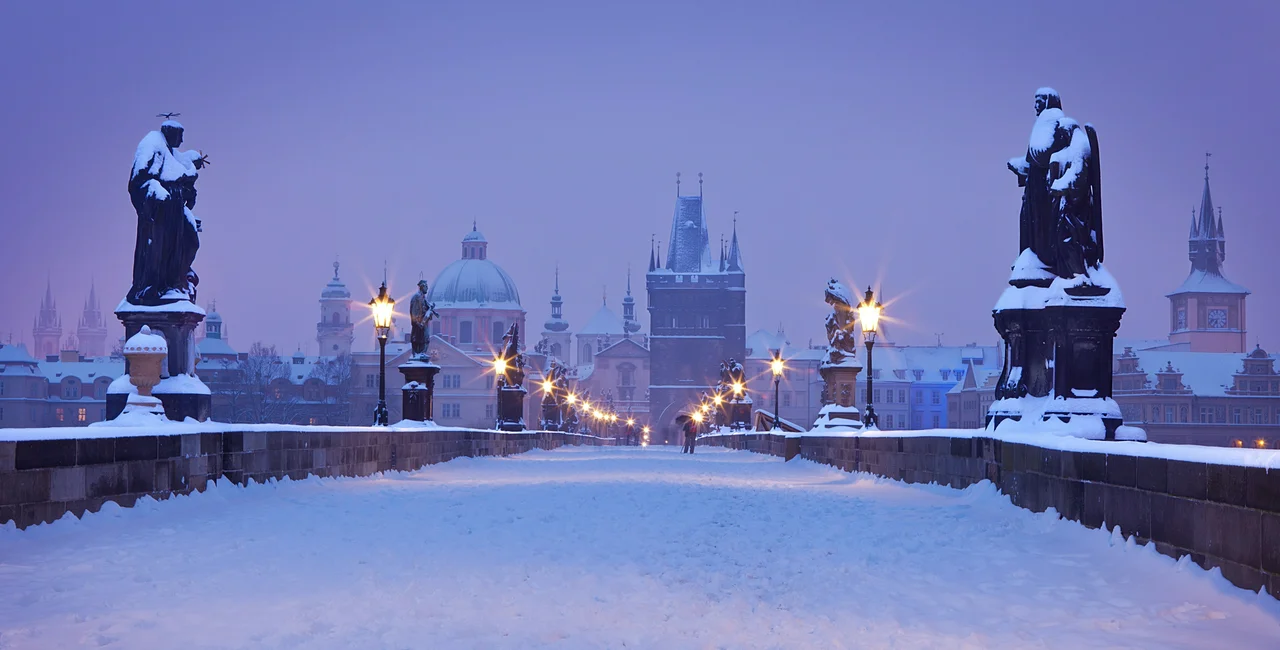 Snow atop Prague's Charles Bridge via iStock / gornostaj