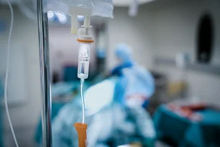 Close-up of IV drip in hospital room via iStock / HRAUN