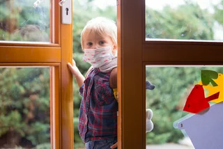 Child wearing a face mask before entering kindergarten. (Photo: iStock, tatyana_tomsickova)