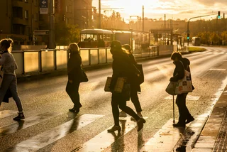 People wearing face masks crossing the street in Prague via iStock / Humanitarian photographer working for UN Agencies